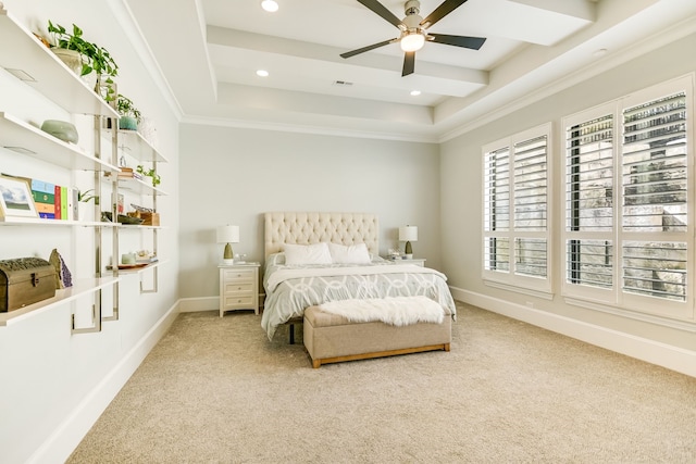 bedroom with a raised ceiling, ceiling fan, and carpet flooring