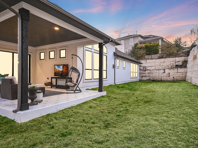 exterior space featuring a patio area, a yard, and outdoor lounge area