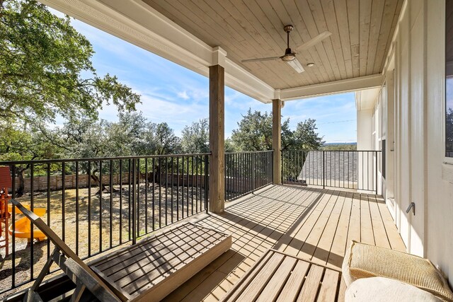 wooden terrace featuring ceiling fan