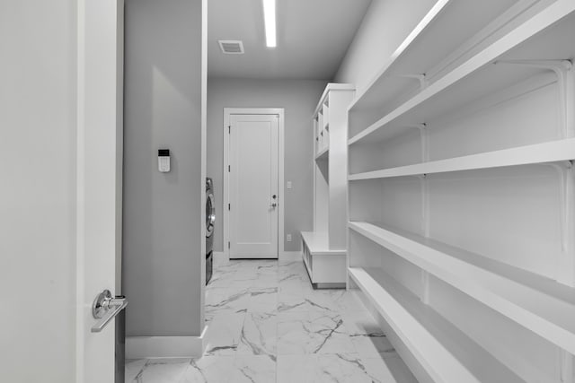 spacious closet featuring light tile patterned flooring