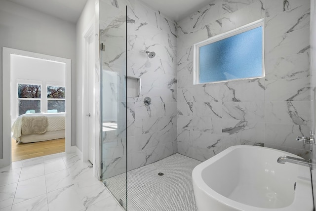 full bathroom featuring ensuite bathroom, a healthy amount of sunlight, marble finish floor, a soaking tub, and a marble finish shower