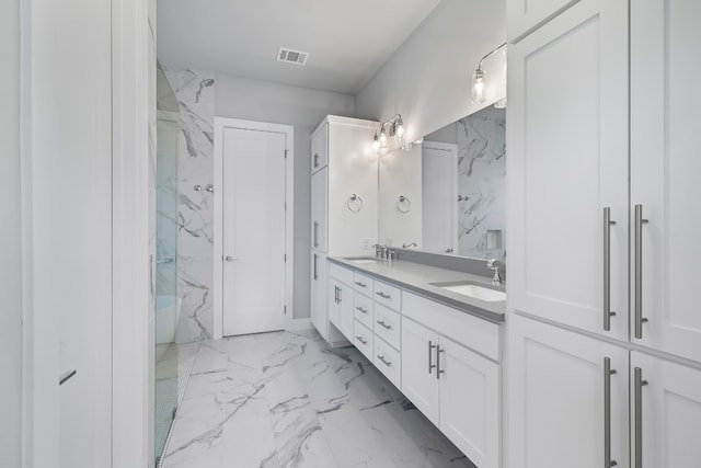 bathroom with walk in shower, tile patterned flooring, and double sink vanity