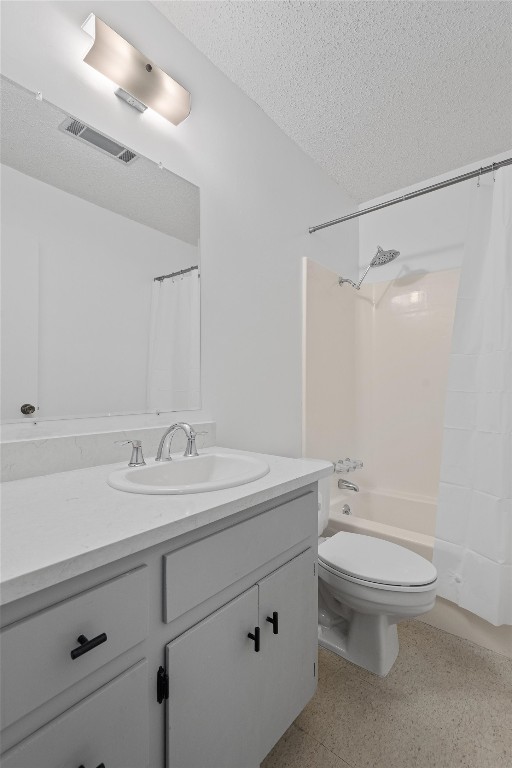 full bathroom featuring vanity, shower / tub combo, a textured ceiling, and toilet