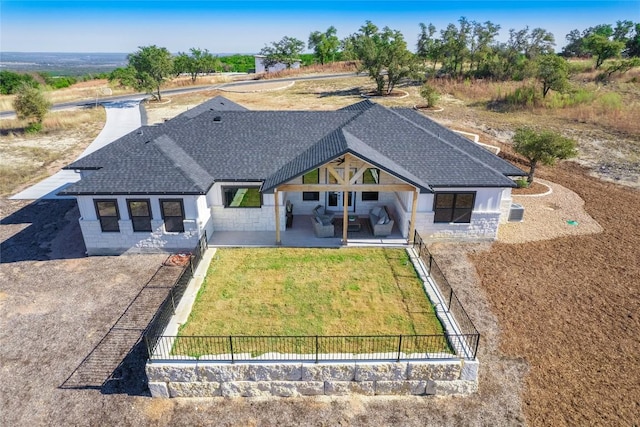 rear view of property with a patio area and a lawn