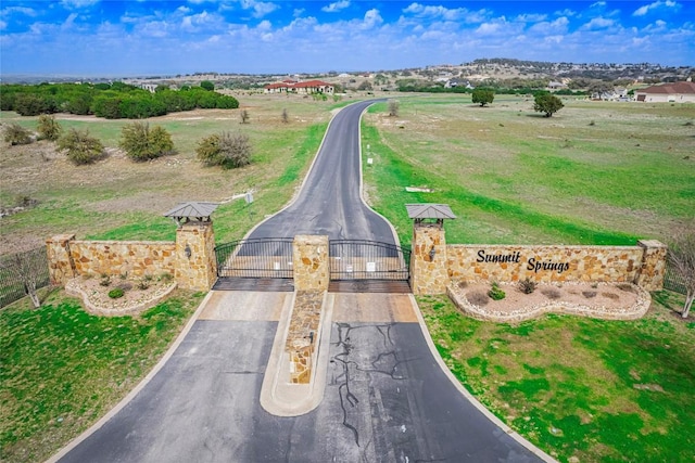 birds eye view of property with a rural view