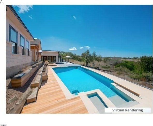 view of pool featuring an in ground hot tub