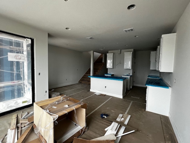 kitchen featuring white cabinetry