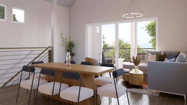 dining room featuring dark hardwood / wood-style flooring and a high ceiling