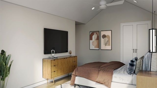 bedroom with light hardwood / wood-style flooring, ceiling fan, and vaulted ceiling