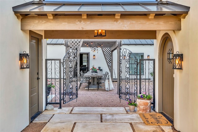 entrance to property featuring a patio area