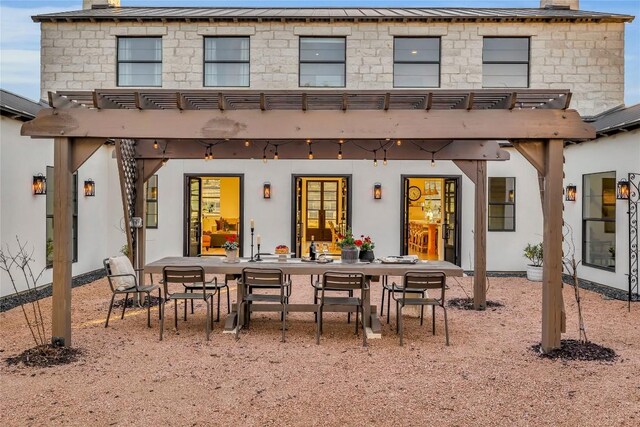 back of house featuring a pergola and a patio area