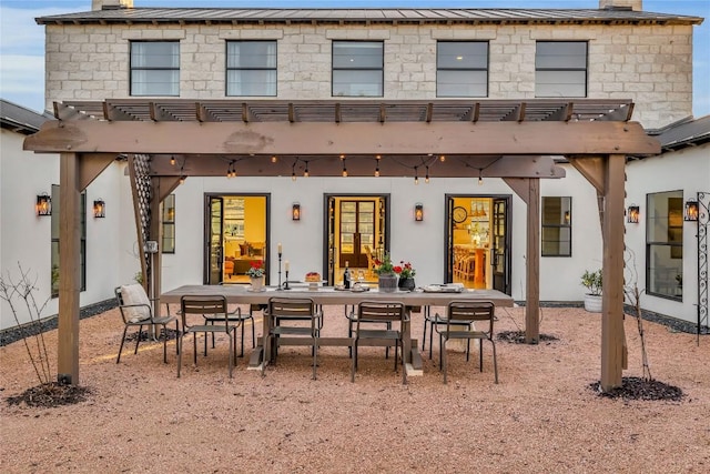130 Overlook Dr, Fredericksburg, TX 78624 - back of property with a pergola, a chimney, and outdoor dining area