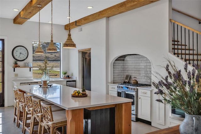 130 Overlook Dr, Fredericksburg, TX 78624 - kitchen featuring gas range, decorative backsplash, beamed ceiling, and fridge