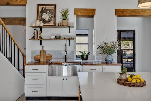 130 Overlook Dr, Fredericksburg, TX 78624 - kitchen with a healthy amount of sunlight and white cabinetry