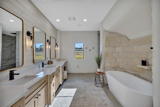 130 Overlook Dr, Fredericksburg, TX 78624 - bathroom featuring a soaking tub, a sink, visible vents, and recessed lighting