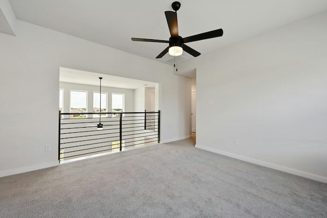 carpeted empty room with ceiling fan