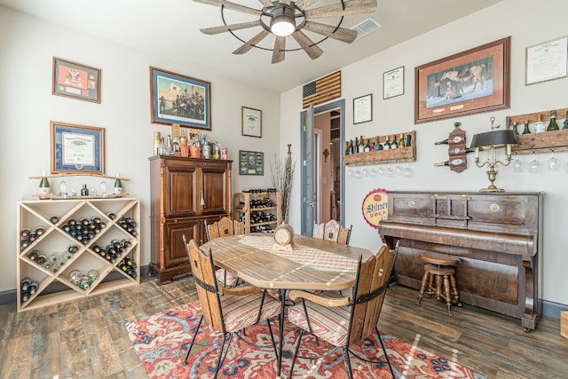 dining space featuring dark hardwood / wood-style floors and ceiling fan