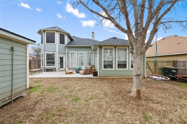 rear view of property featuring a patio