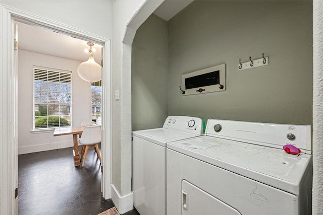 laundry area with washing machine and clothes dryer