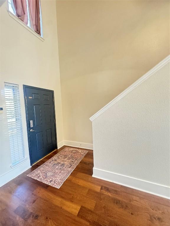 entrance foyer featuring dark wood-type flooring