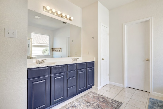 bathroom with vanity and tile patterned floors