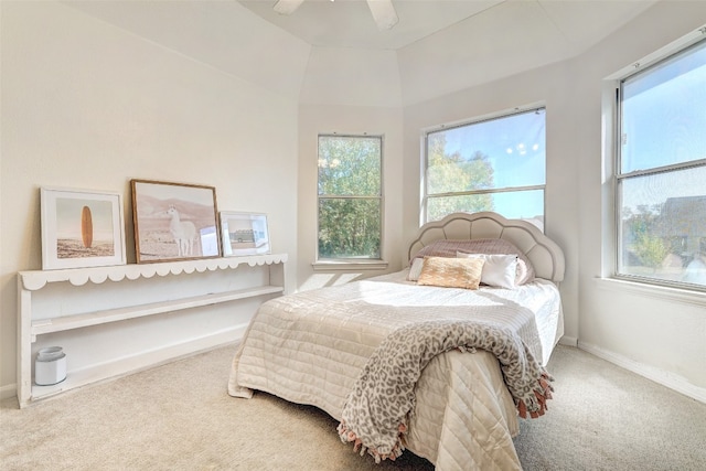 carpeted bedroom featuring ceiling fan and lofted ceiling