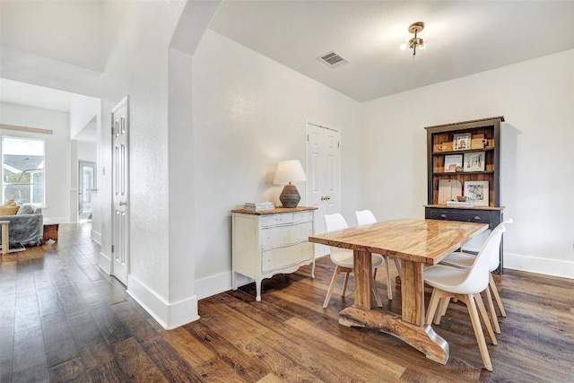 dining area featuring dark hardwood / wood-style floors