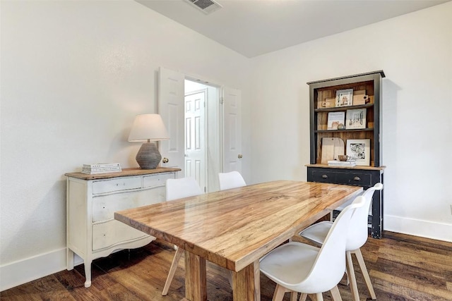 dining space featuring dark hardwood / wood-style flooring