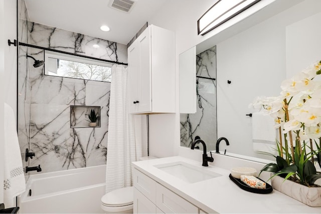 full bathroom featuring toilet, shower / tub combo with curtain, and vanity