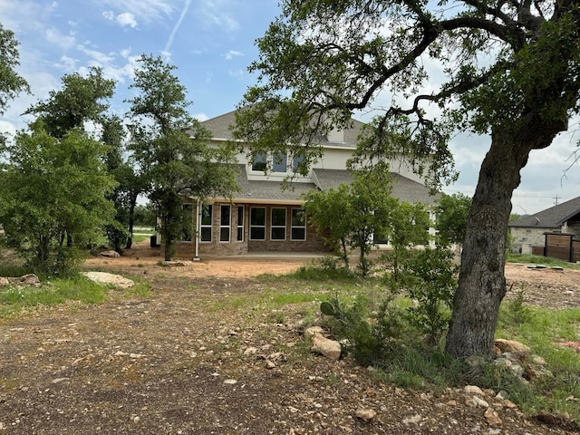 back of property featuring a patio