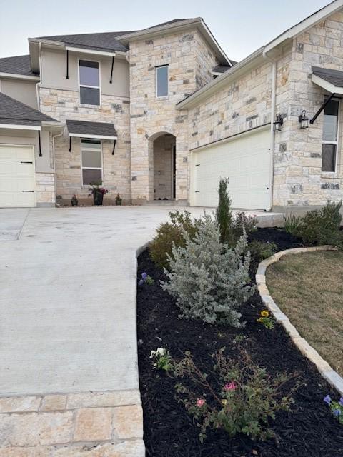 view of front of home with a garage