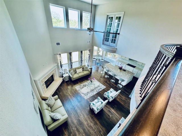 101 Gabwood Ct, Georgetown, TX 78633 - living area featuring a fireplace, a high ceiling, wood finished floors, and ceiling fan