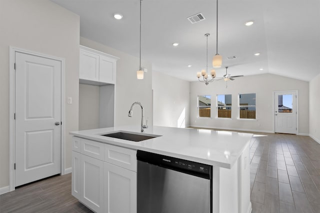 kitchen with dishwasher, a center island with sink, white cabinetry, and sink