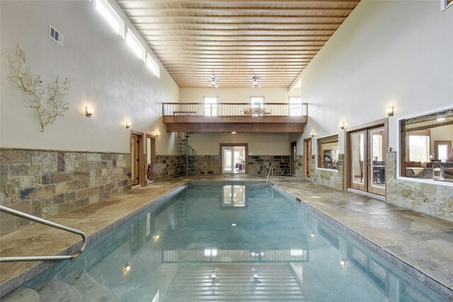 view of pool with french doors