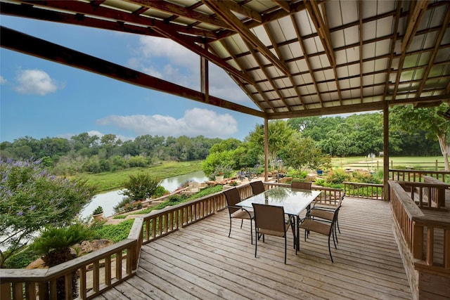 wooden terrace featuring a water view