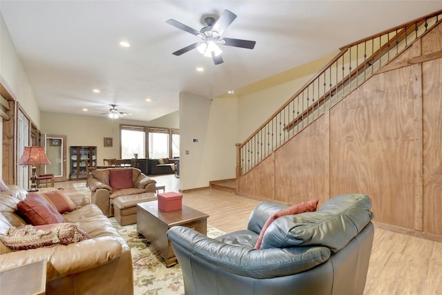 living room with ceiling fan and light hardwood / wood-style floors