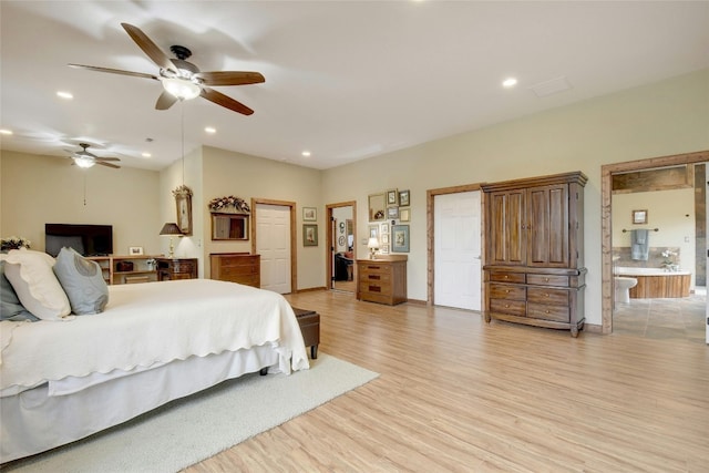 bedroom with ceiling fan and light hardwood / wood-style floors