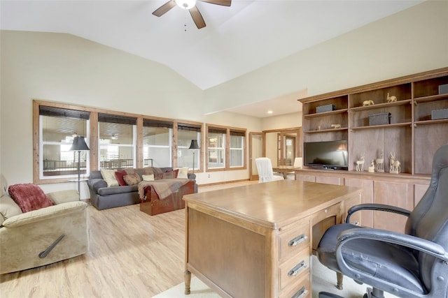 home office featuring lofted ceiling, light wood-type flooring, and ceiling fan