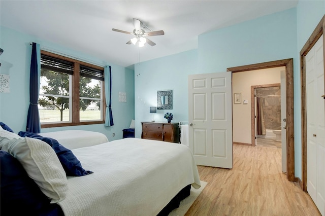 bedroom with ceiling fan and light hardwood / wood-style floors