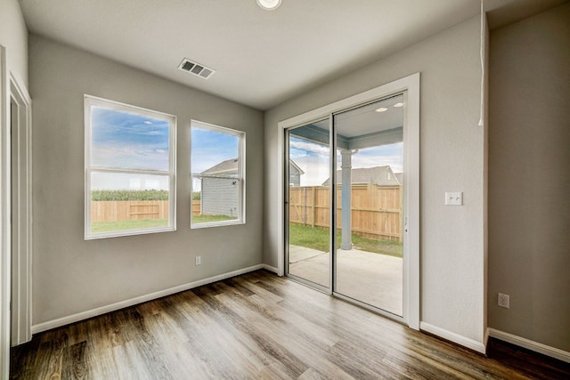 empty room featuring hardwood / wood-style floors