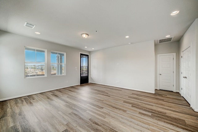 empty room with light wood-type flooring