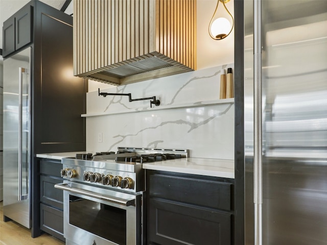 kitchen with light wood-type flooring, decorative backsplash, premium range hood, and stainless steel appliances