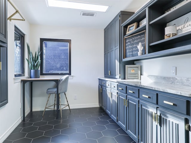 office area featuring dark tile patterned floors