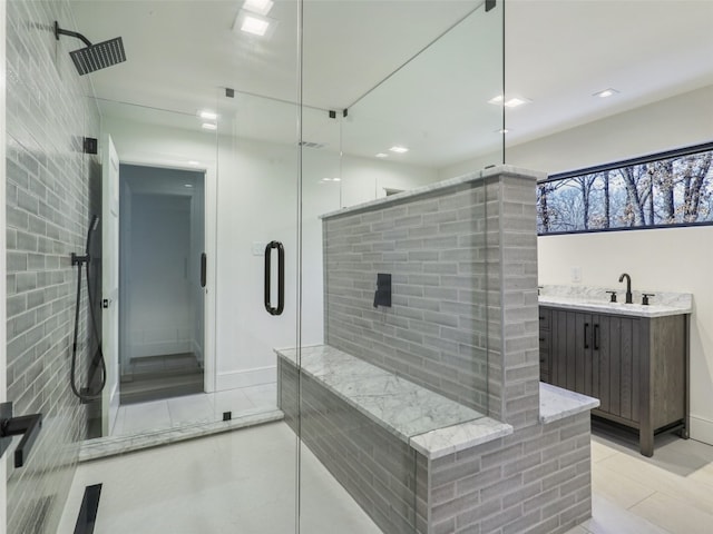 bathroom with tile patterned flooring, vanity, and a shower with shower door