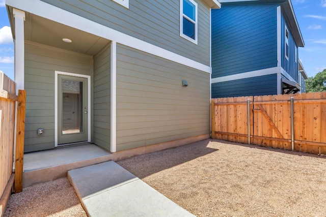 property entrance featuring a patio area