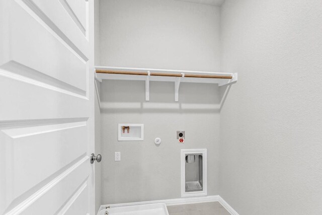 washroom featuring electric dryer hookup, hookup for a gas dryer, washer hookup, and tile patterned flooring