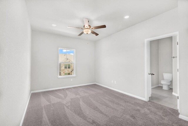 empty room with carpet flooring and ceiling fan