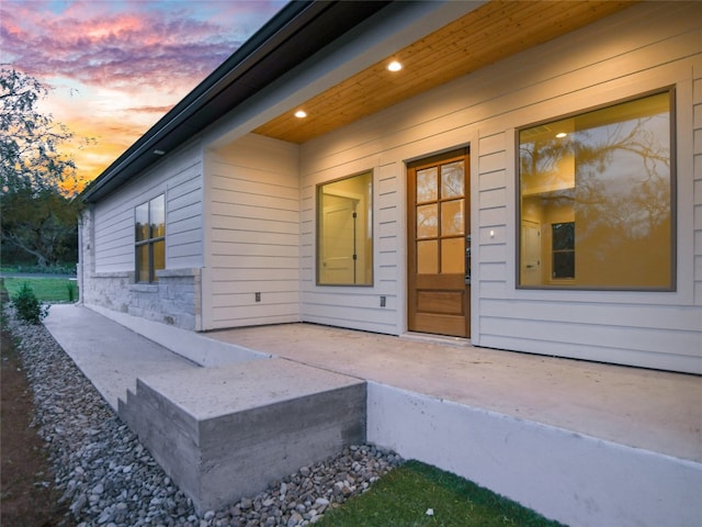 view of exterior entry at dusk