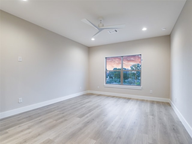 unfurnished room featuring ceiling fan and light hardwood / wood-style flooring