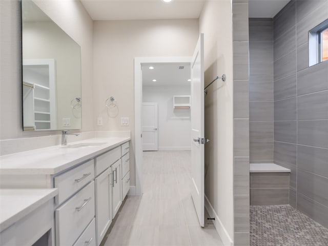 bathroom with vanity and tile floors